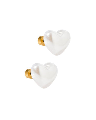Two white heart-shaped ceramic knobs with gold accents on a white background