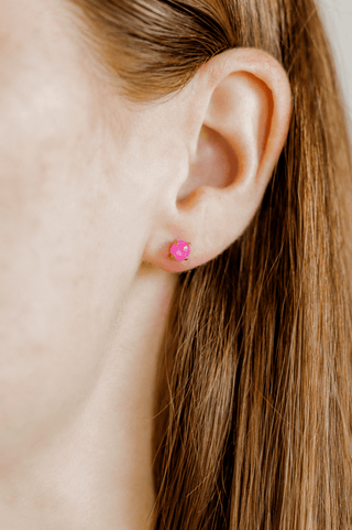 Close-up of an ear with a pink earring