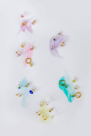 Colorful earrings on a white background