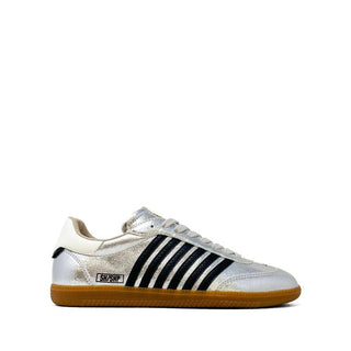 White sneaker with black stripes on a white background