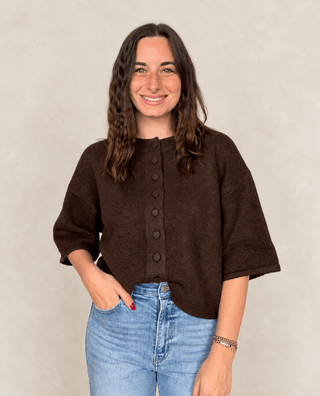 Blue Blossom Model in a chocolate brown button down sweater.