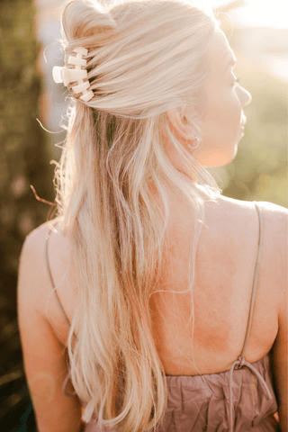 Hair clip with Teleties branding in long blonde hair