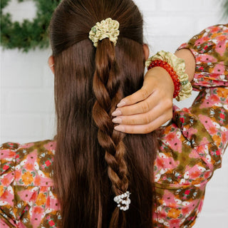Model wearing Berry Cozy hair ties in braided hair