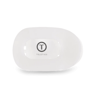 White silicone hair clip on a white background with 'Teleties' branding on a white background