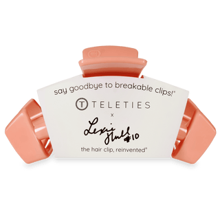 Teleties hair clip with white label and pink clips on a white background