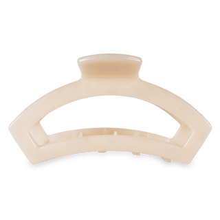 Beige hair clip on a white background