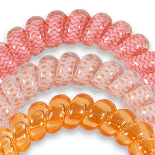 Close-up of Sunny Days Ahead spiral hair coils in pink and orange