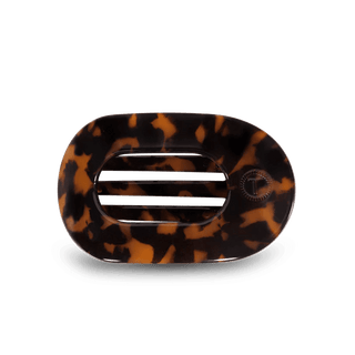 Tortoiseshell patterned hair clip on a white background