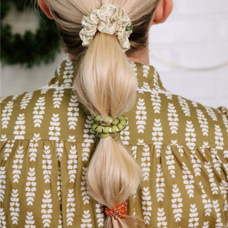 Model wearing Pine & Pearl hair ties in a ponytail
