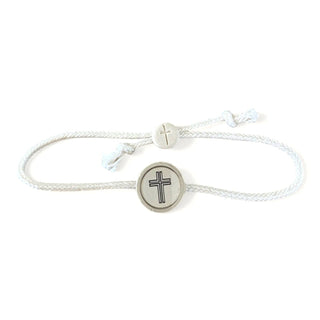 White bracelet with a circular charm featuring a cross on a white background