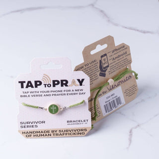Bracelet with 'Tap to Pray' packaging on a marble surface