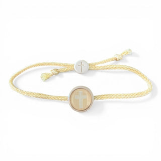 Bracelet with cross charm on a white background