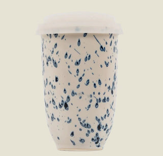 The Wander Sip Mug 12oz in cream with blue speckles