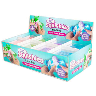 A retail display box of 'Wink Cuts Squishies Blind Box' toys, showing multiple compartments filled with colorful squishy balls and printed promotional graphics on a white background.