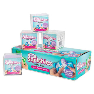 A bulk display of Missy Cri Squishies Blind Box toys, featuring a large teal and pink cardboard box with three smaller individual boxes stacked on top and one standing beside it, all on a plain white background.
