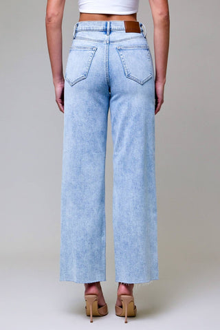 Light blue wide-leg jeans worn by a person on a neutral background