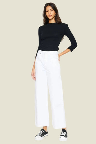 The White Label 90's Ultra High-Rise Wide Leg Jeans in white on model